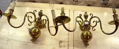 Lot 1256 - Pair of Dutch style brass two light wall lights