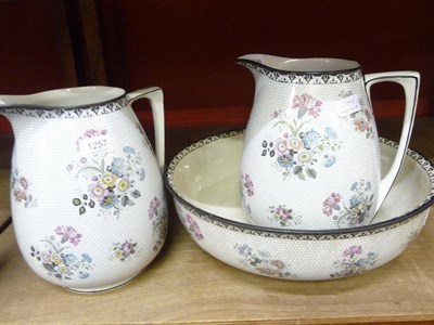 Lot 1257 - Pair of Wedgwood & Co pottery water jugs and a basin