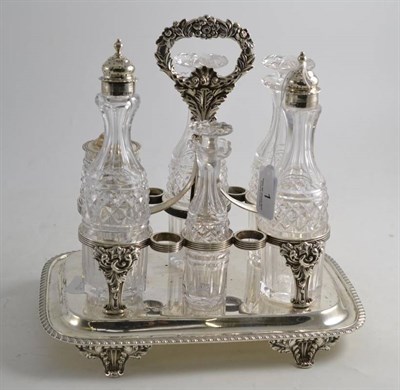 Lot 1 - An early 19th century silver six bottle cruet stand