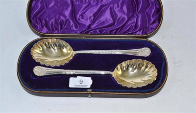 Lot 9 - Pair of Walker & Hall silver serving spoons with shell-shaped handles, in fitted box