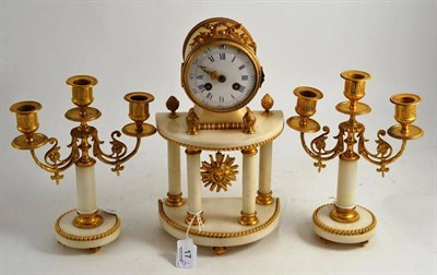 Lot 17 - A gilt metal and white marble striking mantel clock with garniture, circa 1890, 32cm high, with...