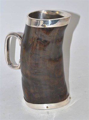 Lot 18 - A horn jug with white metal mounts