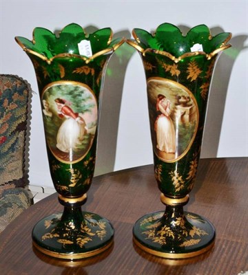 Lot 67 - A pair of Victorian Bohemian green glass vases, decorated with a young lady reading a love...