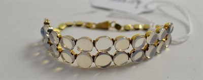 Lot 89 - A moonstone bracelet, a double row of graduated cabochon moonstones, to a fancy link bracelet,...