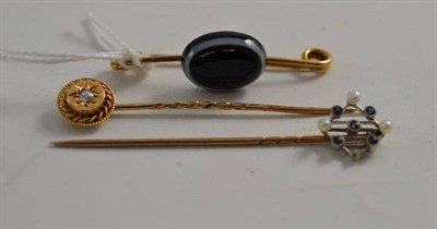 Lot 110 - A sardonyx brooch, a sapphire and seed pearl stick pin and a diamond set stick pin