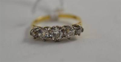 Lot 121 - A graduated diamond five stone ring, the old cut diamonds in white claw settings