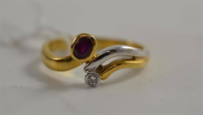 Lot 122 - A ruby and diamond two colour twist ring, stamped '750'
