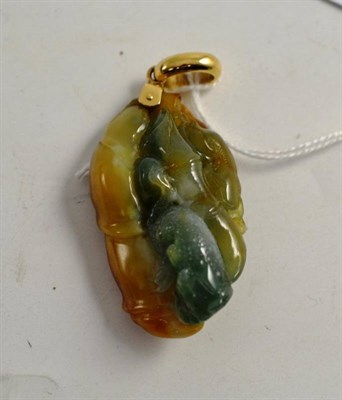 Lot 145 - A Chinese carved variegated jade/jadeite animal and bamboo pendant with yellow metal suspension...