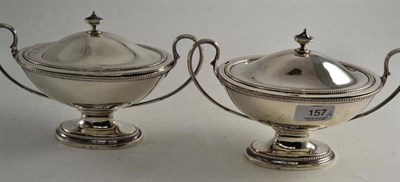 Lot 157 - A pair of Georgian silver sauce tureens and covers