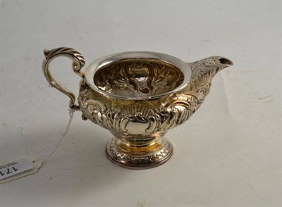 Lot 171 - A George IV silver cream jug, makers mark CF, London 1824, 16.5cm