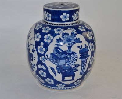 Lot 181 - A 19th century Chinese blue and white ginger jar and cover, decorated with antiques on a prunus...