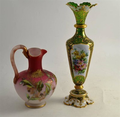 Lot 187 - A 19th century Bohemian glass vase decorated with floral panels and a pink and floral glass jug