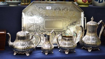 Lot 194 - A good quality silver plated tray with pierced gallery, scroll feet and twin handles and a four...