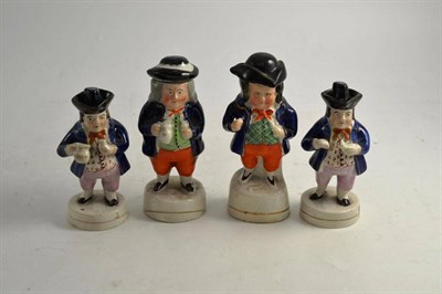 Lot 213 - Four 19th century Staffordshire Toby condiments