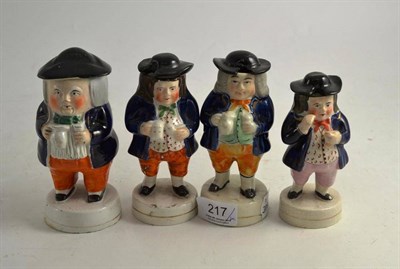 Lot 217 - Four 19th century Staffordshire Toby condiments