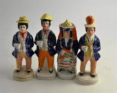 Lot 219 - Two 19th century Staffordshire pepperettes and two 19th century condiments modelled as figures