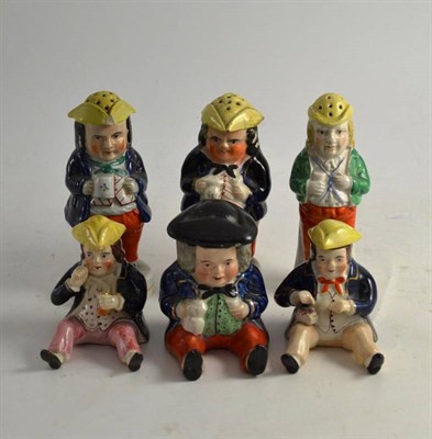 Lot 222 - Three 19th century Staffordshire Toby pepperettes and three condiments modelled as seated Toby...