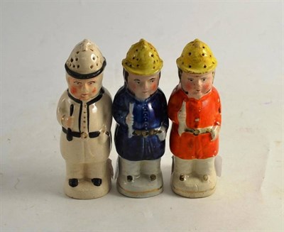 Lot 223 - Three Staffordshire pepperettes modelled as policemen (small)