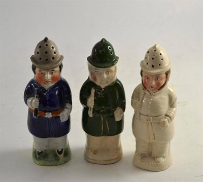 Lot 224 - Three Staffordshire pepperettes modelled as policemen (large)