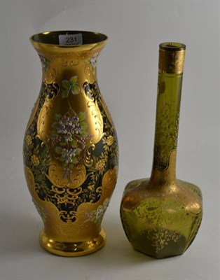 Lot 231 - A Bohemian green glass gilt decorated vase and a larger example decorated with pink and white...