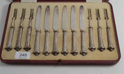 Lot 248 - A set of six dessert knives and forks with plated steel blades and loaded handles, Sheffield...