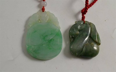 Lot 264 - A Chinese jade/jadeite bat and cash pendant and a three rat and fruit pendant (2)