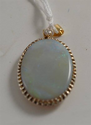 Lot 266 - An opal and diamond pendant, measures 2.8cm by 4.8cm