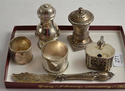 Lot 271 - A Georgian silver pepperette (finial removed), a caster, a mustard pot, two napkin rings and a...