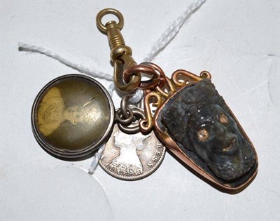 Lot 277 - A black iridescent stone carved as a head mounted as a fob and a charm