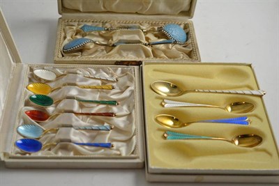 Lot 295 - A pair of Russian silver gilt and enamel caviar spoons in a fitted case, a set of six silver...