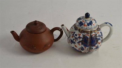 Lot 374 - A Chinese terracotta small teapot and an Imari decorated example (a.f.)