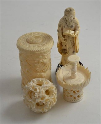 Lot 377 - Chinese ivory puzzle ball, Japanese figure and an African ivory box (3)