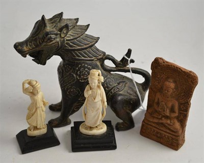 Lot 378 - Bronze figure of a dragon, two early 20th century ivory figures and a terracotta carving