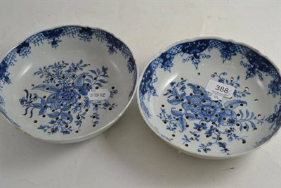 Lot 388 - Two 18th century Chinese export blue and white porcelain strainer bowls