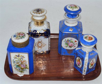 Lot 400 - Four 19th century blue ground and floral decorated scent bottles with stoppers