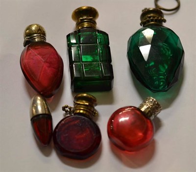 Lot 464 - Six Victorian/Edwardian silver and brass stoppered ruby and emerald glass scent bottles