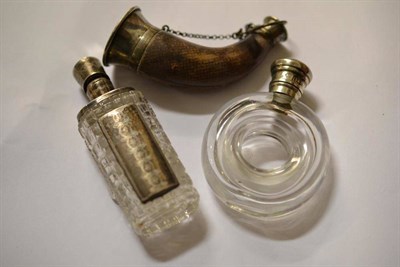 Lot 469 - Three white metal mounted scent bottles, 19th century, including a donut shape example, and another