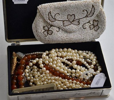 Lot 513 - A box containing a silver thimble, a comb, simulated pearl beads, costume jewellery