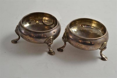 Lot 522 - A pair of Georgian cauldron salts, each quite plain on three hoof feet