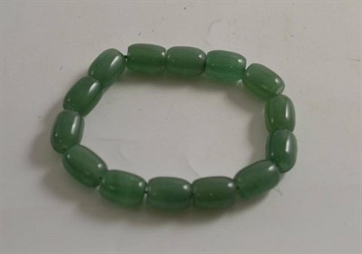 Lot 526 - A Chinese jade/jadeite bracelet