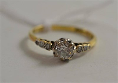 Lot 540 - A diamond solitaire ring, with stone set shoulders