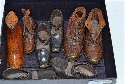 Lot 543 - Pair of children's leather boots, two pairs of clogs, an odd leather boot and a treen boot...