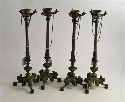 Lot 550 - Set of four 20th century classical bronze candlesticks