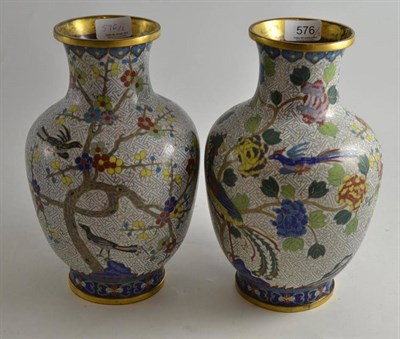 Lot 576 - A pair of late 19th/early 20th century Chinese cloisonne vases decorated with phoenix birds and...