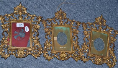 Lot 594 - Three Victorian gilt metal easel frames for miniatures