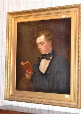 Lot 650 - A 19th century gilt framed oil on canvas, portrait of a gentleman reading a book