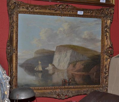 Lot 785 - A 19th century oil on board of boats by cliffs in a gilt frame