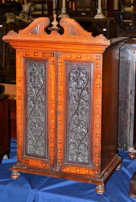 Lot 821 - A 19th century cabinet with butterfly