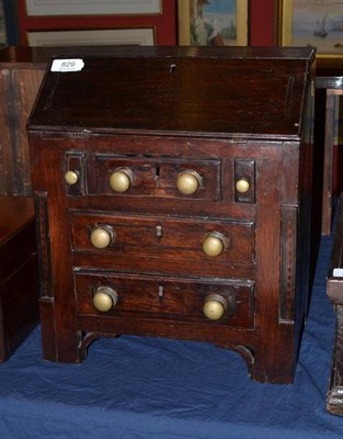 Lot 829 - Provincial oak miniature bureau