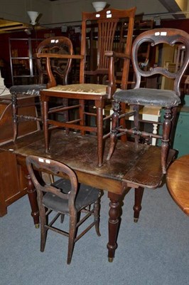 Lot 845 - A Victorian drop leaf writing table fitted one drawer, three Victorian balloon back chairs and...